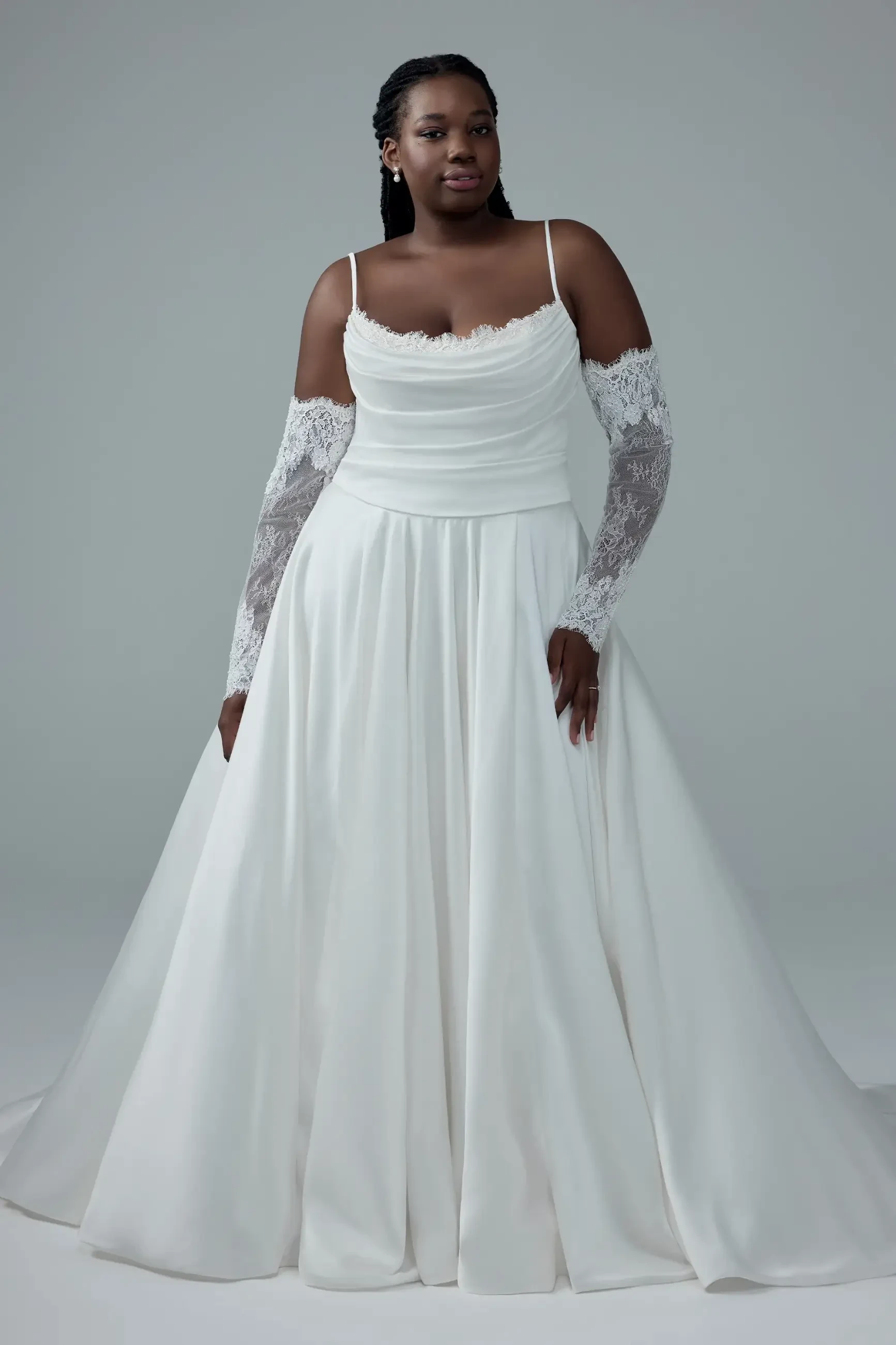 model is wearing a sleeveless a-line wedding dress with long sleeve off the shoulder detachable sleeves